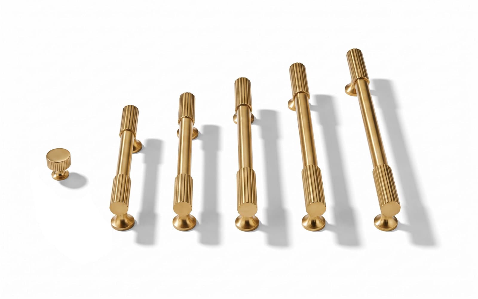 Coordinated cabinet knobs and pulls in a consistent finish
