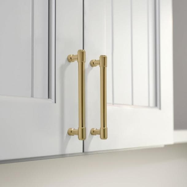 Cabinet pulls and knobs arranged for a coordinated kitchen hardware plan